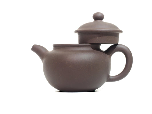 Lian Zi Yixing Teapot with lid lifted, showcasing interior and clay craftsmanship