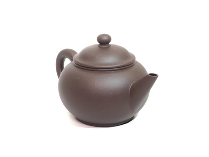 220ml Shui Ping Yixing Teapot angled right view – highlighting spout and clay texture