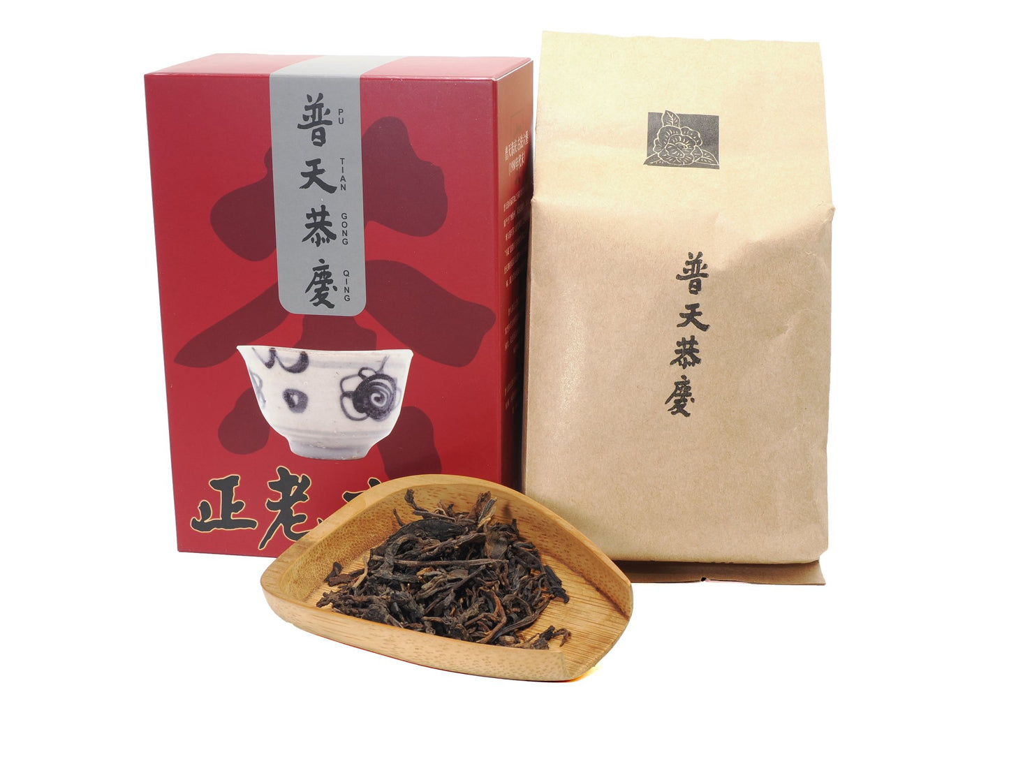 Celebration Liu Bao tea — box, pouch and dry leaves on bamboo tray; traditionally processed, Malaysian aged