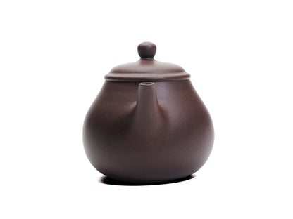 Front view of the Da Ming Yuan Luo Han teapot focusing on the slender spout and domed lid.