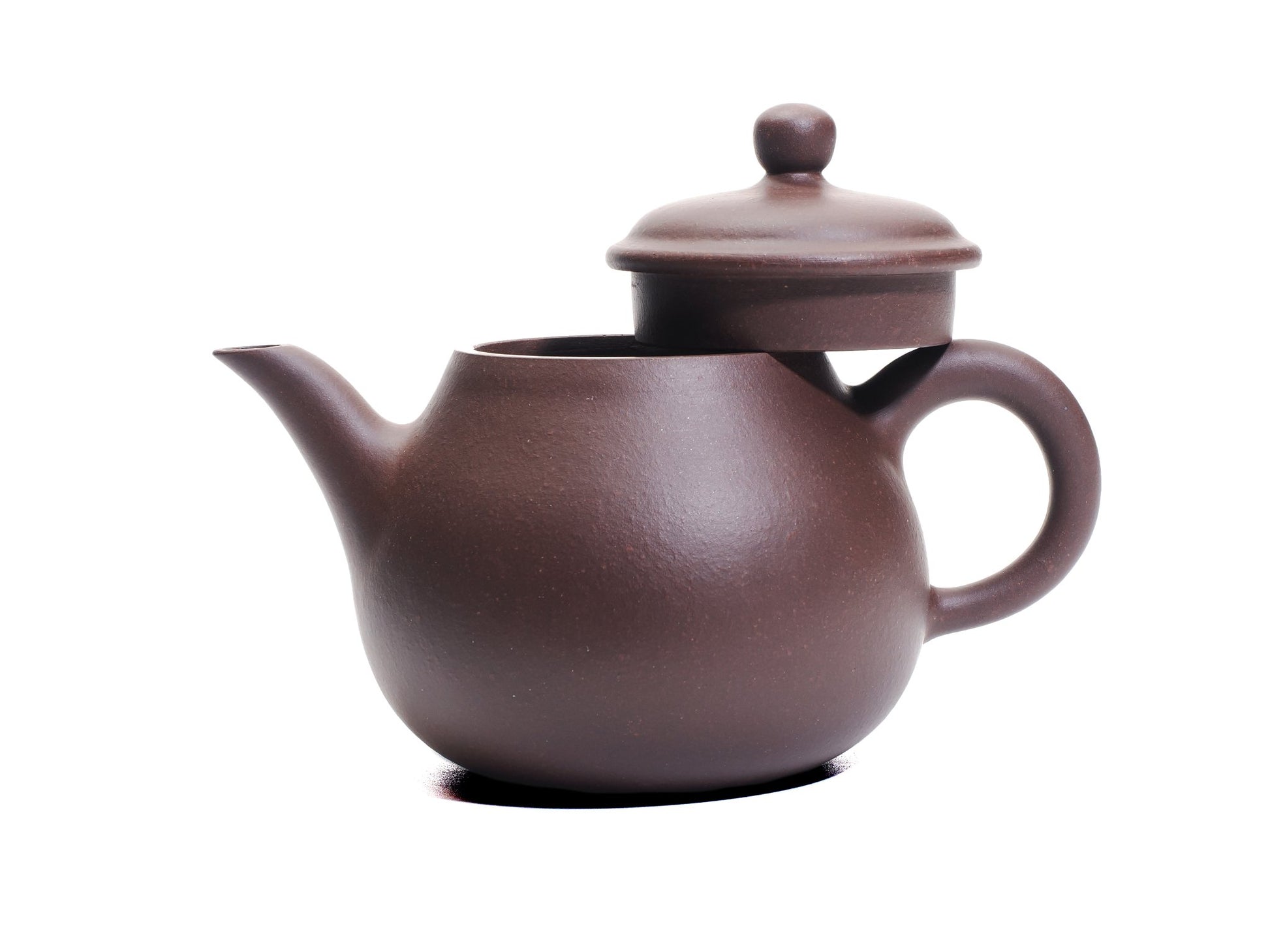 Da Ming Yuan Luo Han teapot with lid removed and resting on the handle, revealing the wide mouth and elegant profile.