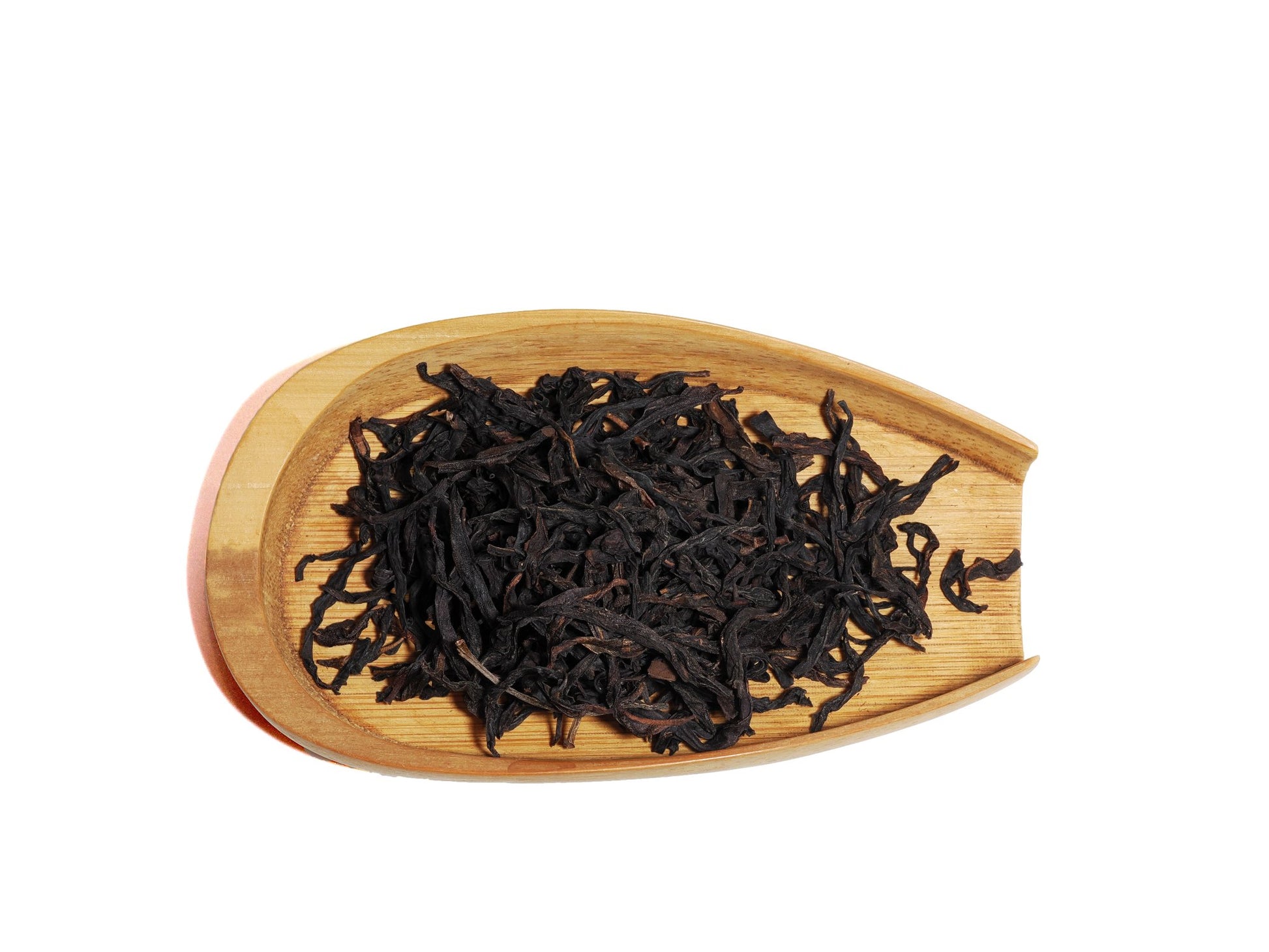 Dry twisted leaves of Phoenix Song Zhong Dancong Oolong Tea on bamboo tray