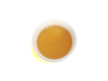Phoenix Song Zhong Dancong Tea – golden tea liquor in white porcelain cup