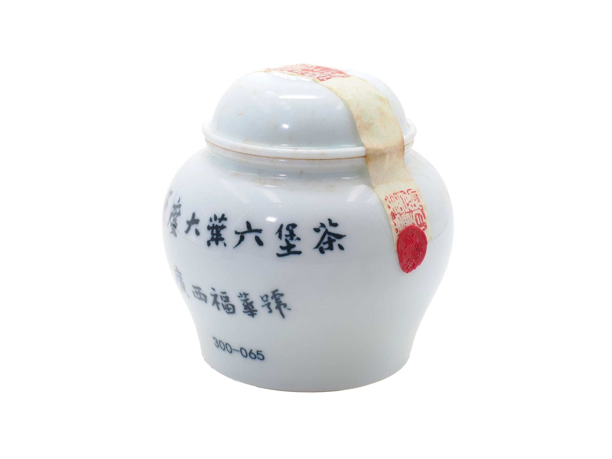Sealed porcelain jar of Fuhua Liu Bao Tea from 1950s with red wax seal and Guangxi markings