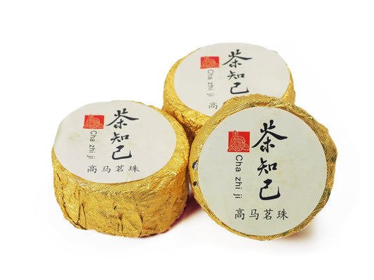 Cha Zhi Ji Gao Ma Jin Hua Hei Cha – three individually wrapped golden mini Tuan Cha compressed dark tea cakes