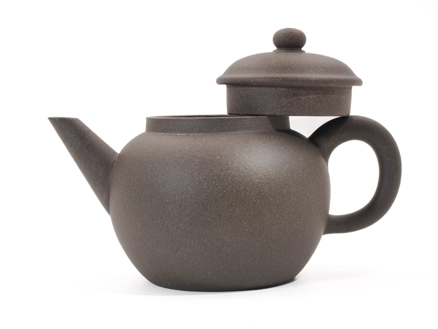 Gold Grade teapot with lid propped open, showing the precise fit and the granular texture of the Gold Grade clay.
