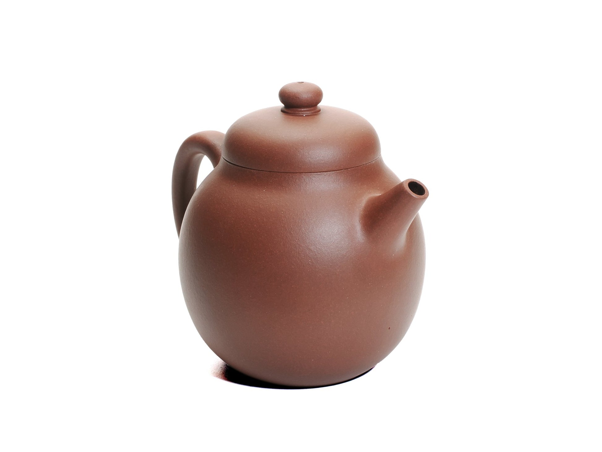 Angled front‑left view of the Zhao Zhuang Hong Ni Da Long Dan teapot, showing its tall egg‑shaped body, short spout and rich reddish‑brown clay.