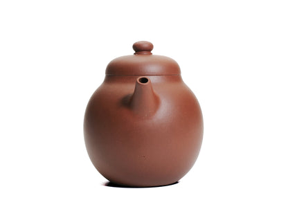 Front view of the Ming‑style Da Long Dan teapot showing the short spout emerging from the egg‑shaped body and the rounded lid knob.