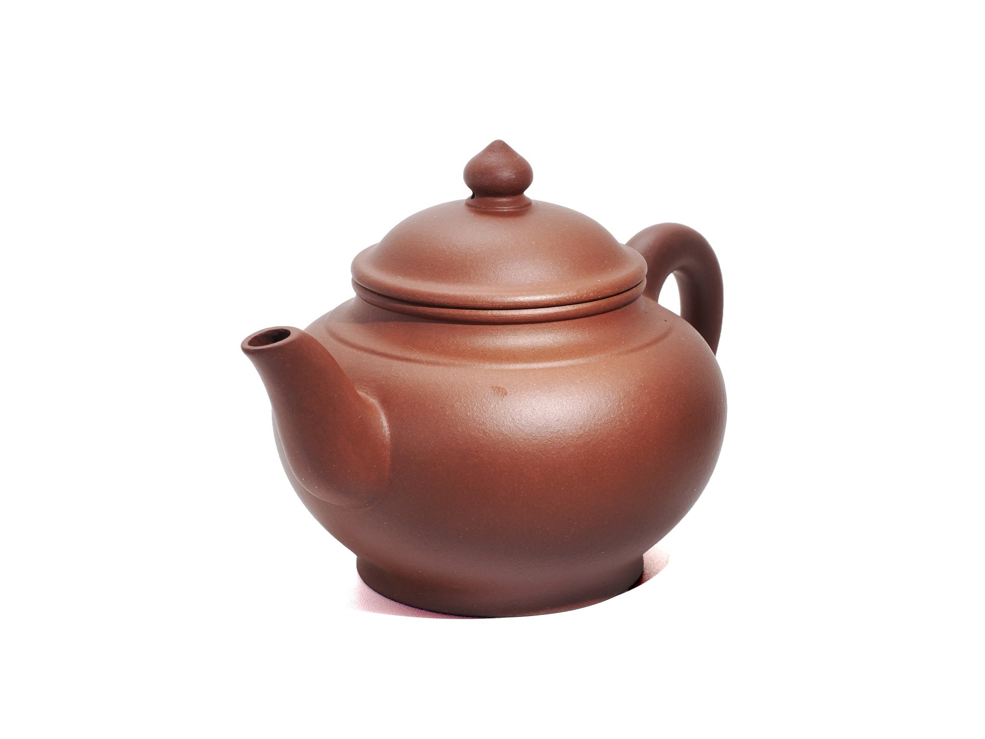 Angled front‑left view of the Hong Pi Long Xiao Ying Hu teapot showing its rounded belly, short spout and cherry‑shaped lid knob.