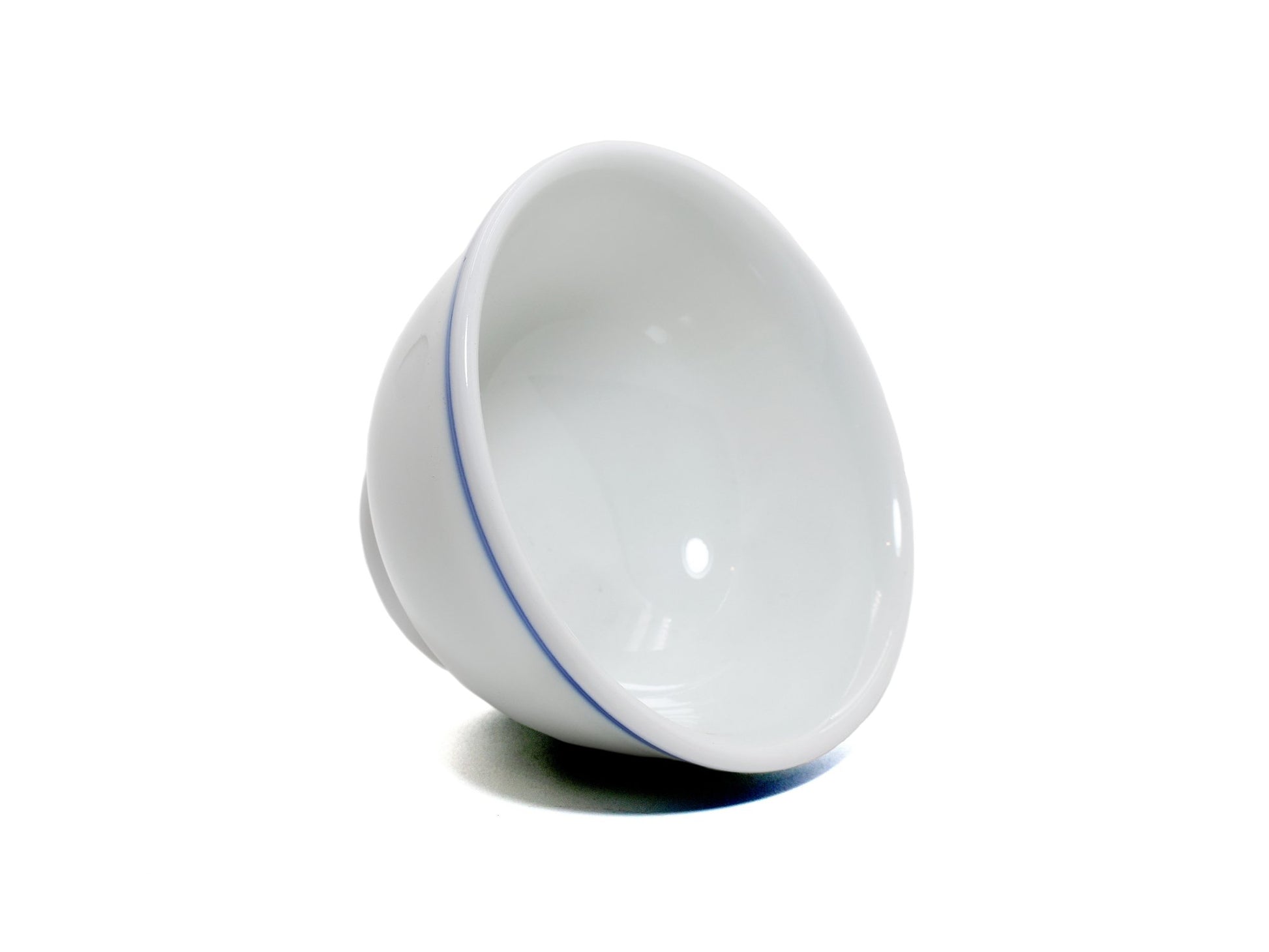 Minimalist blue line cup tilted, glossy white glaze
