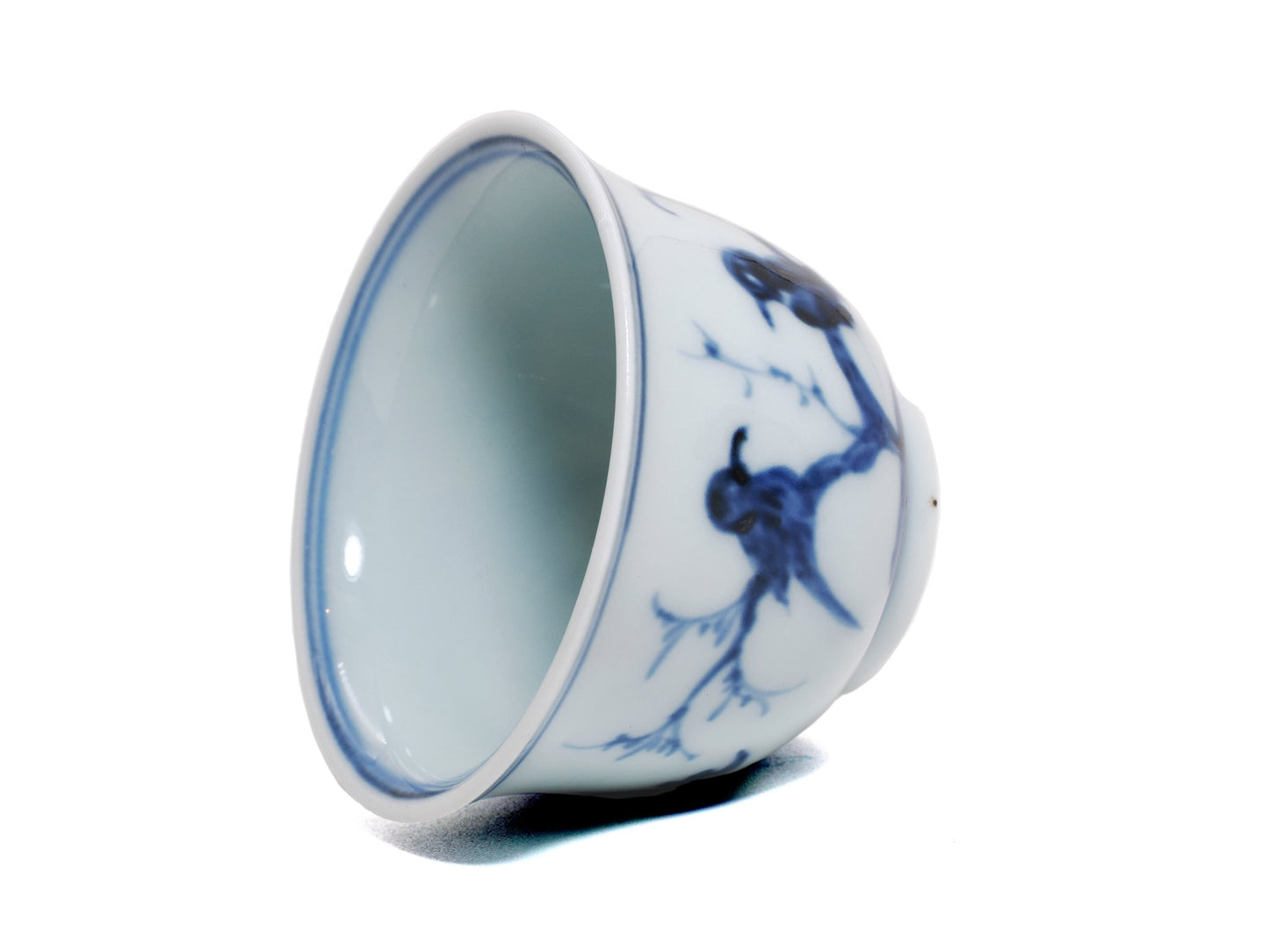 Rim and inner wall detail of Jingdezhen porcelain teacup