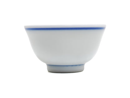 Modern Jingdezhen blue line porcelain teacup, side view with cobalt rim