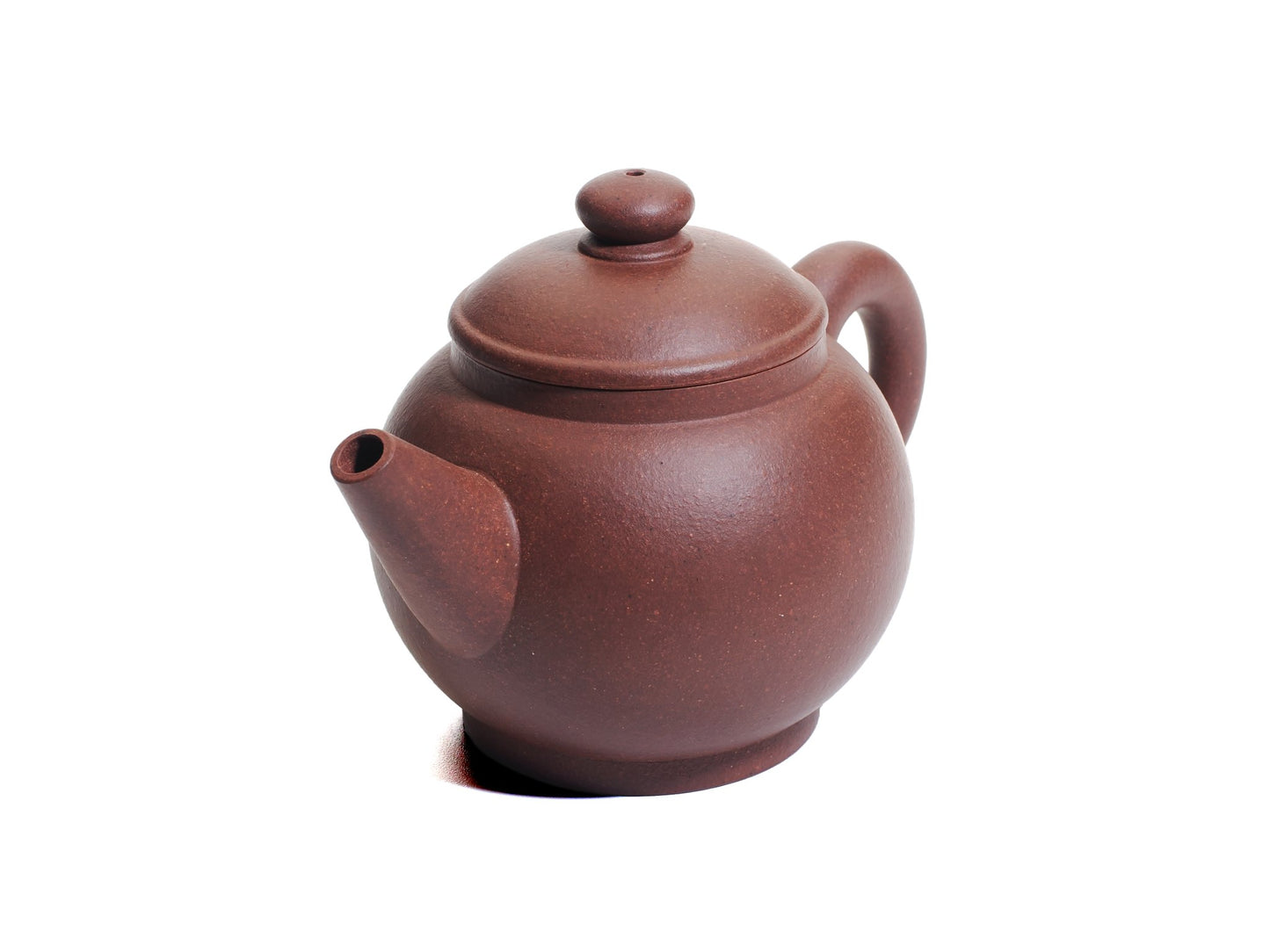 Angled top view of the Ju Lun Zhu teapot showcasing the short spout, domed lid and rounded body.