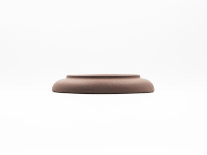 Elevated base view of special grade Lao Zini tea coaster with smooth curve