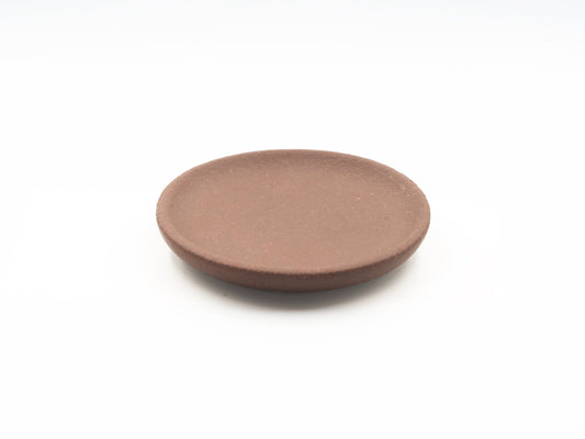 Top view of Lao Zini Dehou tea coaster in round minimalist design