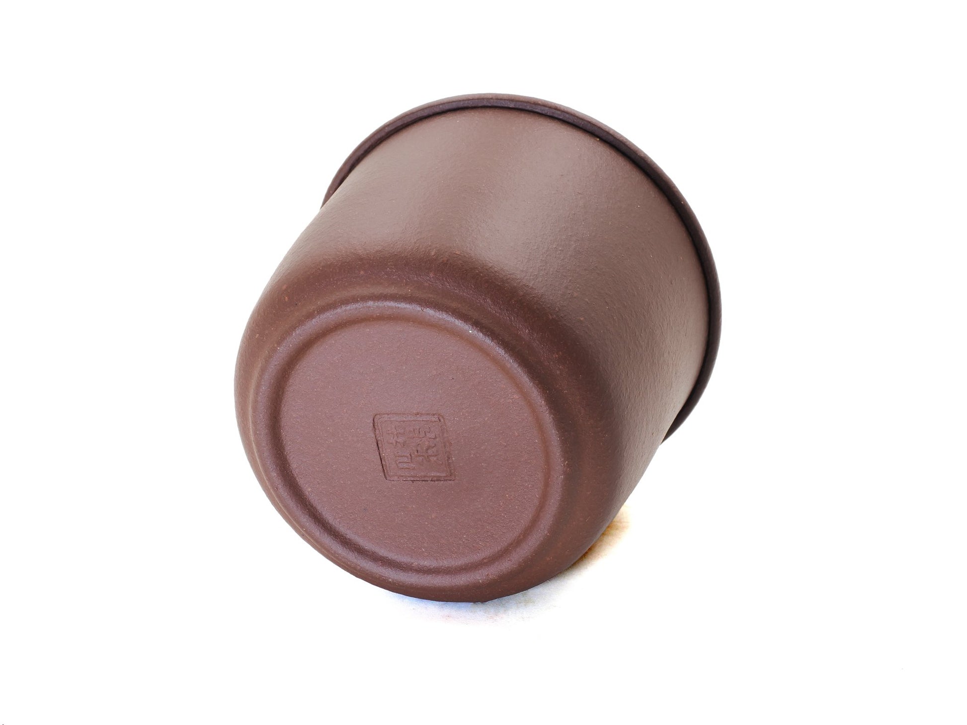 Base of Yixing tea jar showing artisan stamp mark