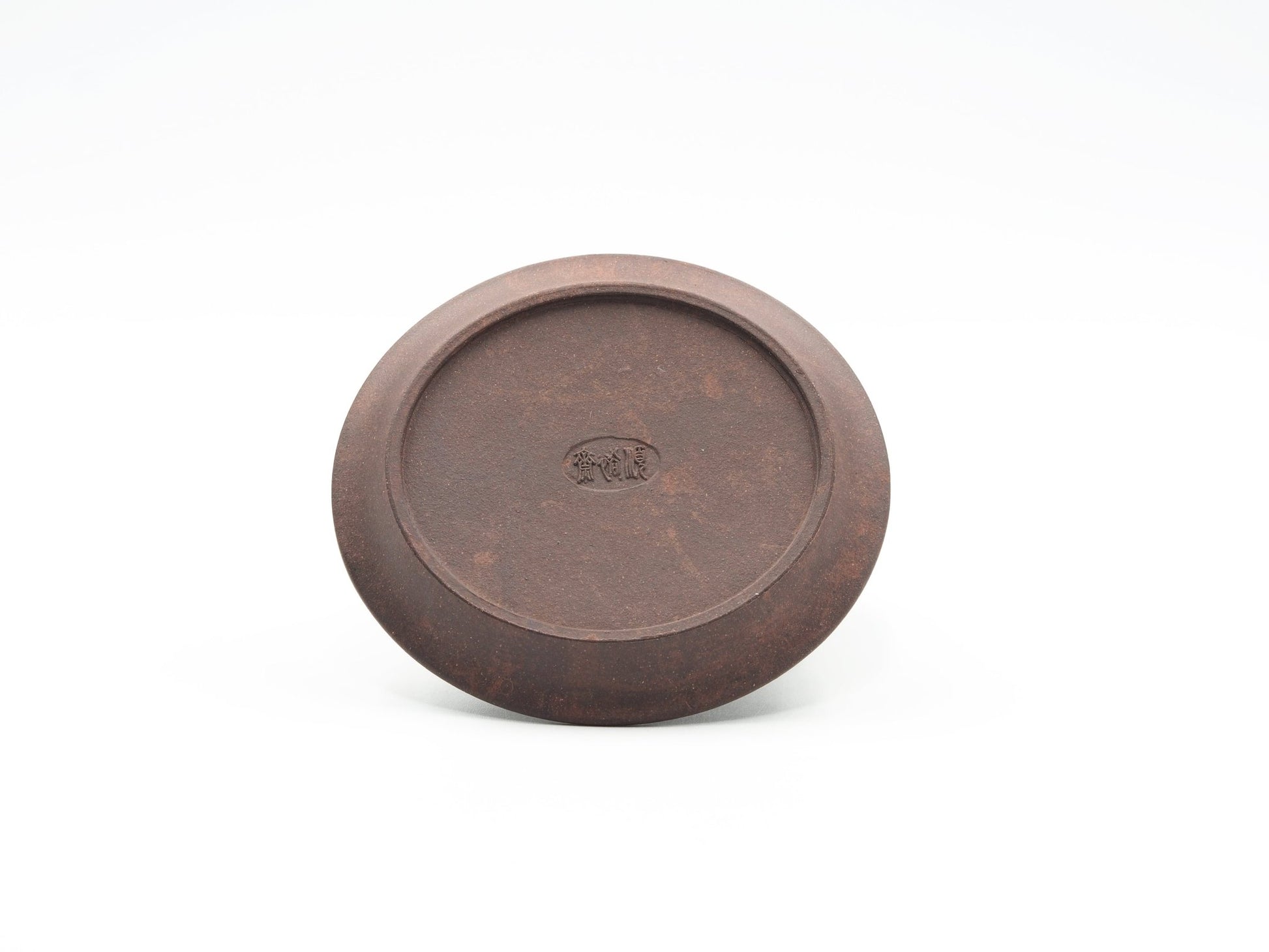 Bottom view of carved Yixing Tea Coaster in Bronze Grade clay with maker’s mark