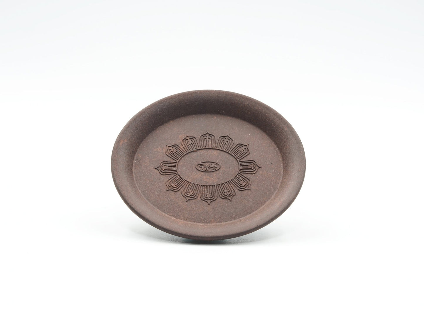 Front view of Oval Yixing Tea Coaster showing carved lotus flower design