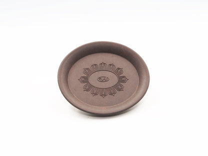 Top-down view of the Yixing Tea Coaster showing lotus flower carving in full