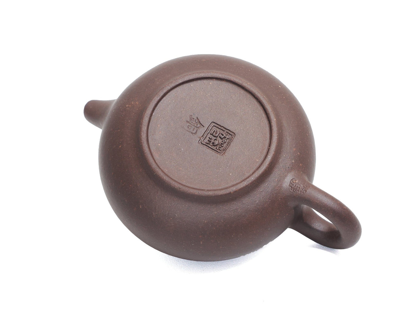 Bottom view of Pan Hu Yixing Teapot 50ml showing maker’s seal and smooth base