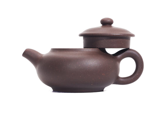 Side view of Pan Hu Yixing Teapot 50ml with lid lifted, showing Bronze Grade clay