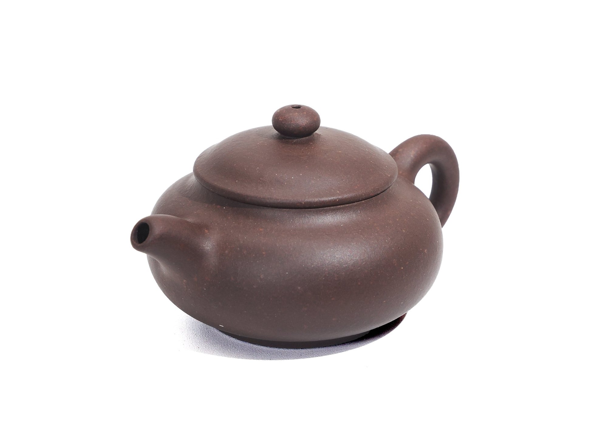 Angled top-left view of Pan Hu Yixing Teapot 50ml, classic shape with rich clay tone
