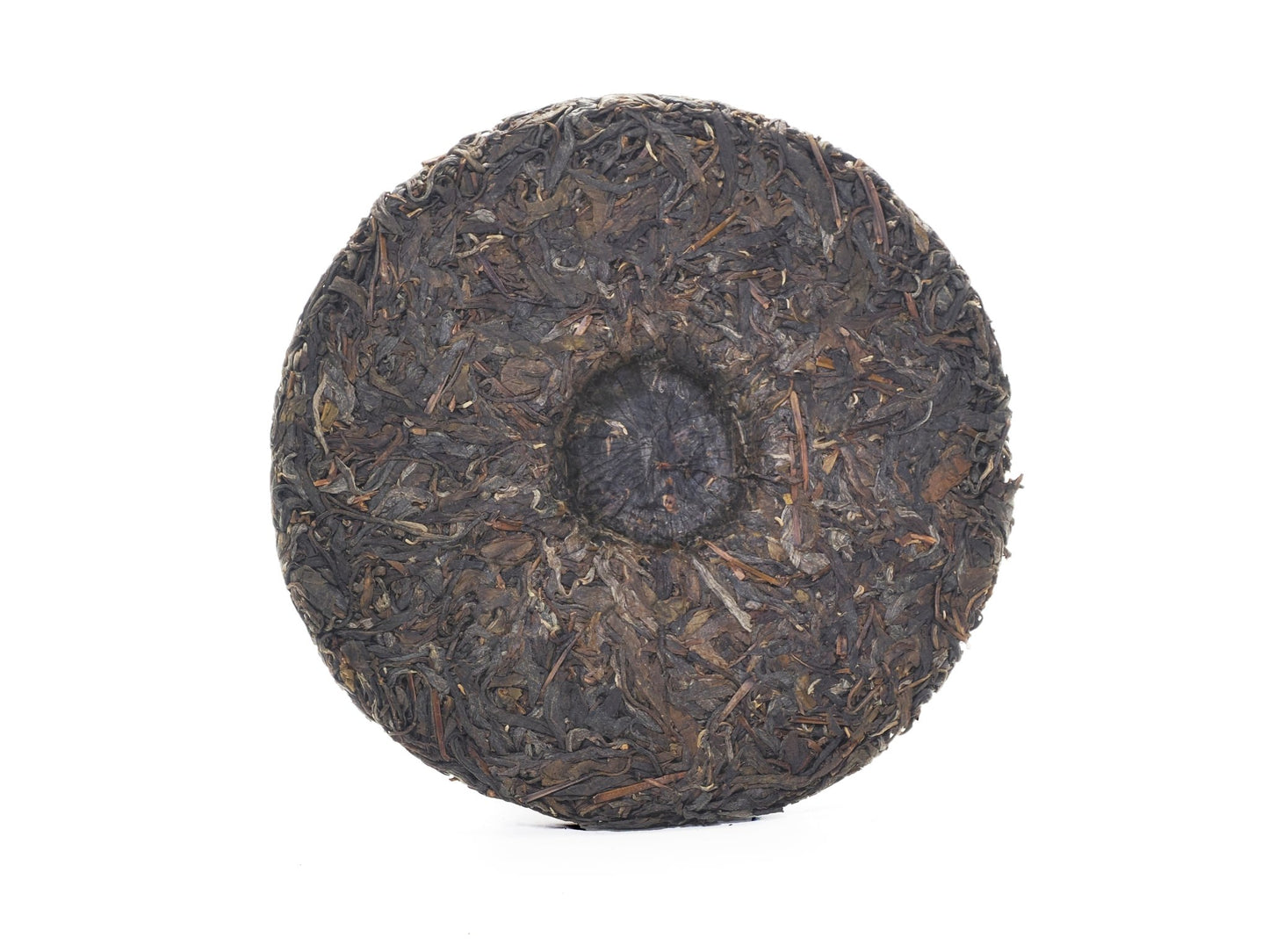 Unwrapped tea cake back showing center dimple