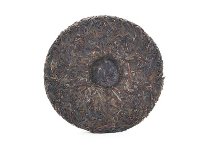 Unwrapped tea cake back showing center dimple