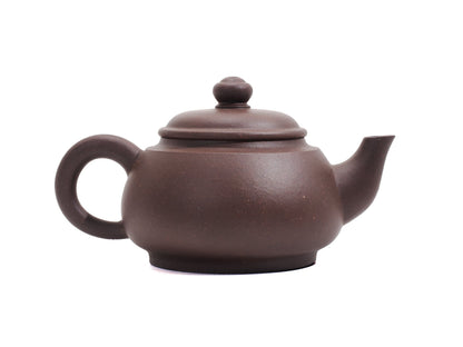 Handle side of Wu Yun Yixing teapot with traditional curve
