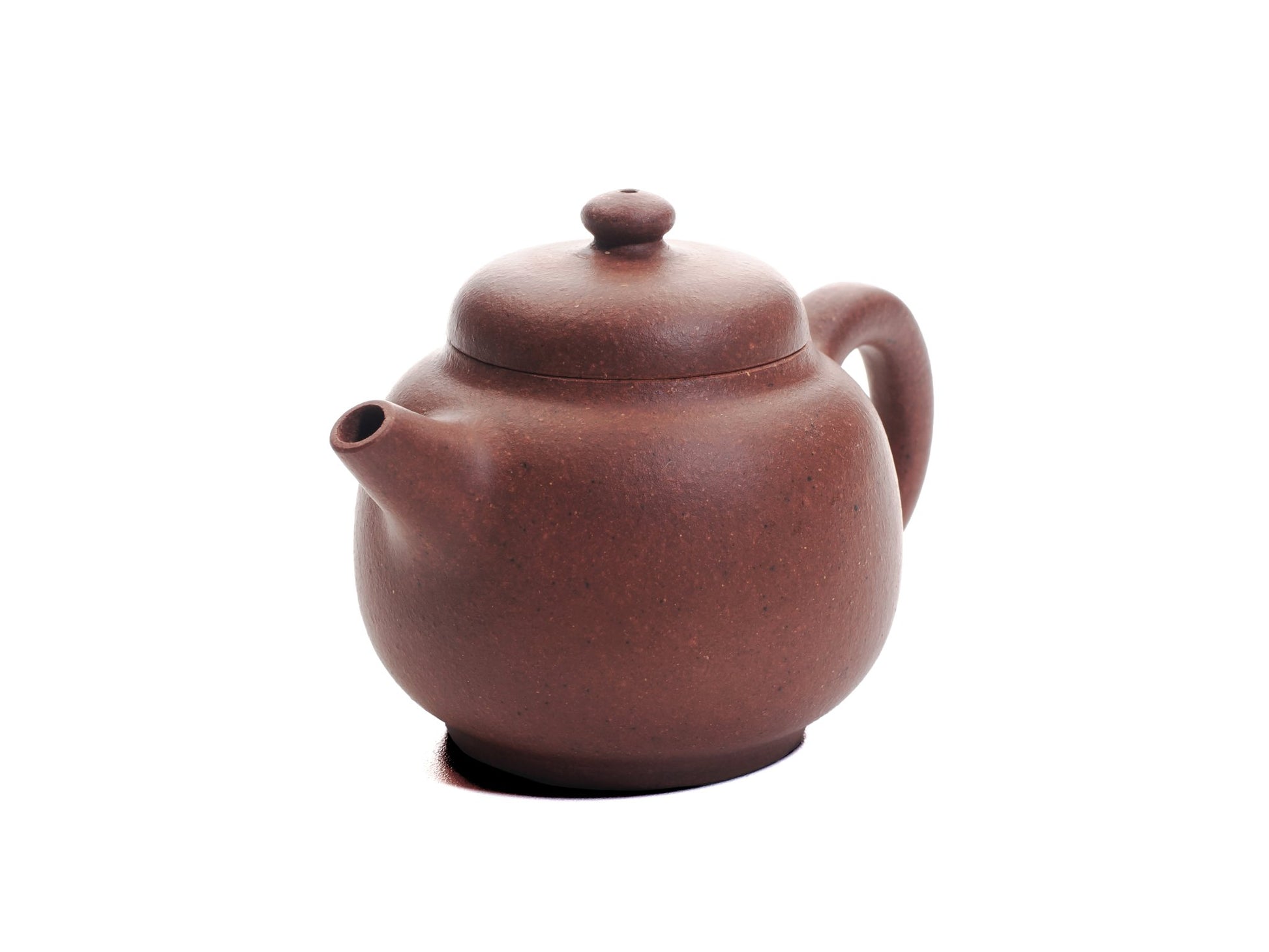 Angled front view of the Xiao Da Bin handmade Yixing teapot crafted from diamond‑grade purple clay.