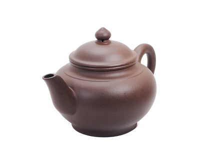 Angled front‑left view of the Xiao Ying Yixing teapot displaying the curved spout, rounded belly and small 180 ml size.