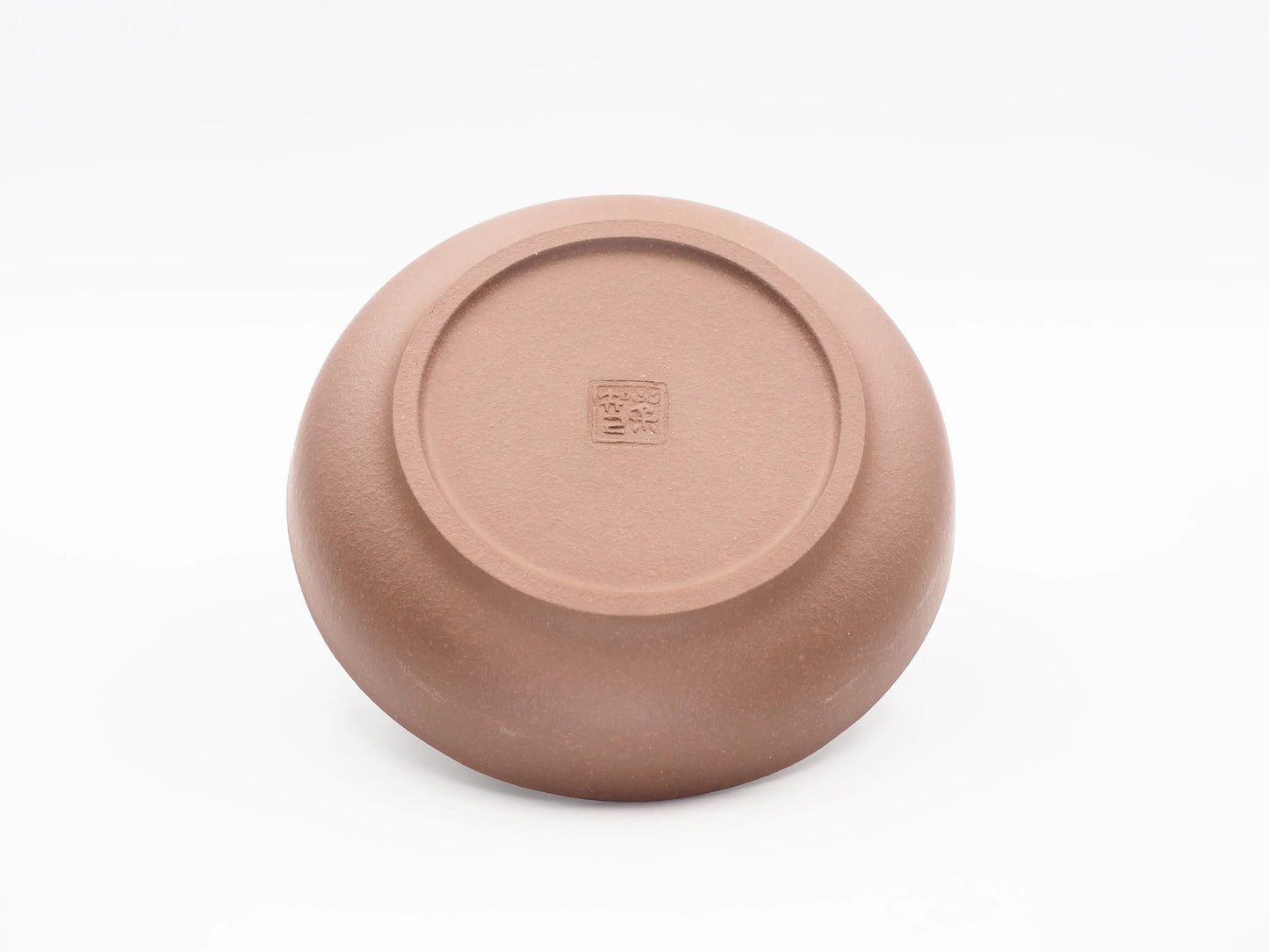 Underside of the Yixing clay tea boat showing the artisan's seal stamp