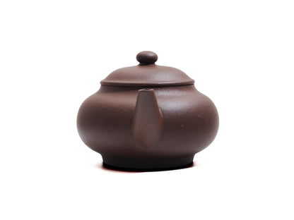 Front spout view of Cha Zhi Ji Junde Yixing teapot in bronze grade purple clay