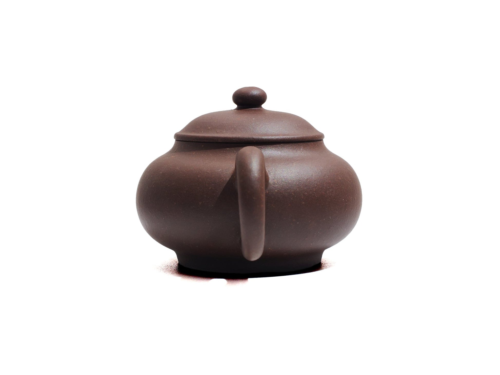 Back handle view of Cha Zhi Ji Junde Yixing teapot in bronze grade purple clay