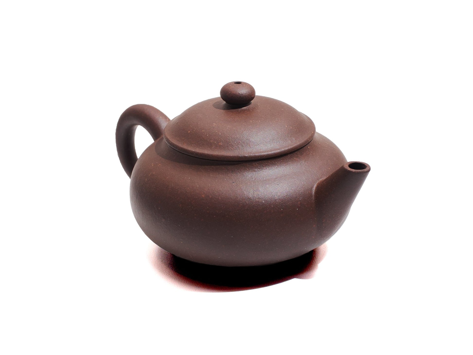Side angle of Cha Zhi Ji Yixing teapot Junde in bronze grade purple clay