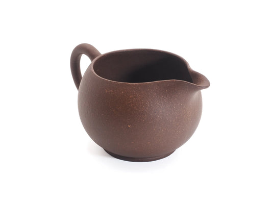 Angled view of the Yixing purple clay cha hai fairness pitcher