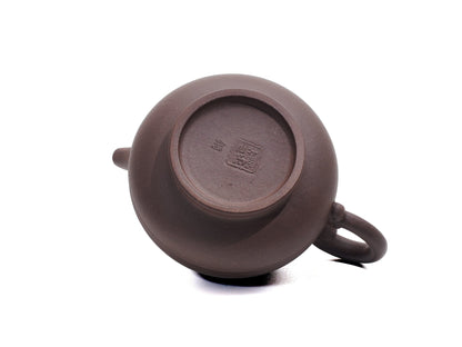 Base of Yu Li Yixing teapot featuring clay stamp and potter mark