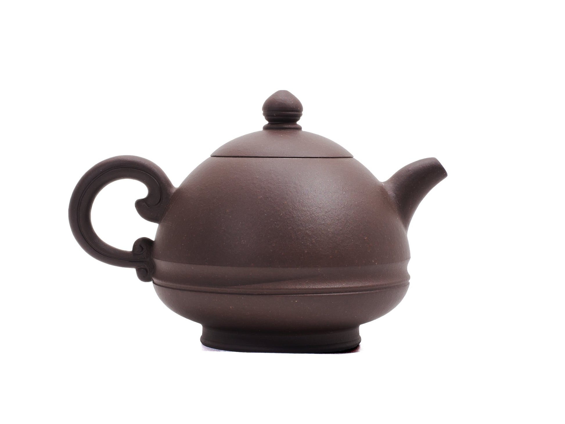 Handle side of Yu Li teapot featuring elegant swirl handle