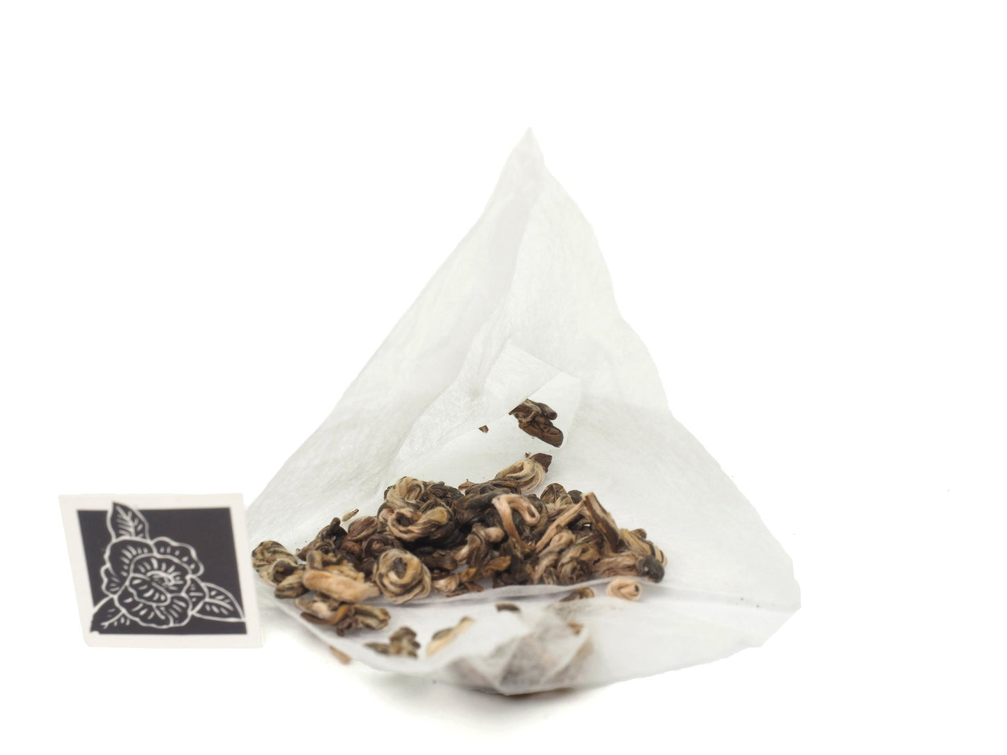 Loose leaves of premium whole green tea leaves in tea bags from Cha Zhi Ji