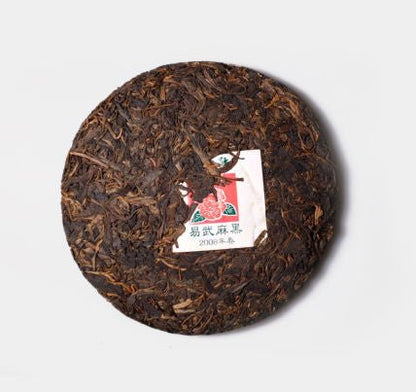 Whole tea cake of Yi Wu Zheng Shan Sheng Pu-Erh tea from 2008 by Cha Zhi Ji